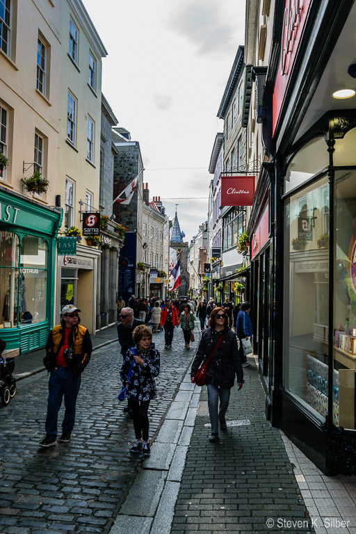 City Street,church spire and clock in background. (1/160 sec at f / 6.3,  ISO 100,  20 mm, 18.0-55.0 mm f/3.5-5.6 ) May 02, 2017