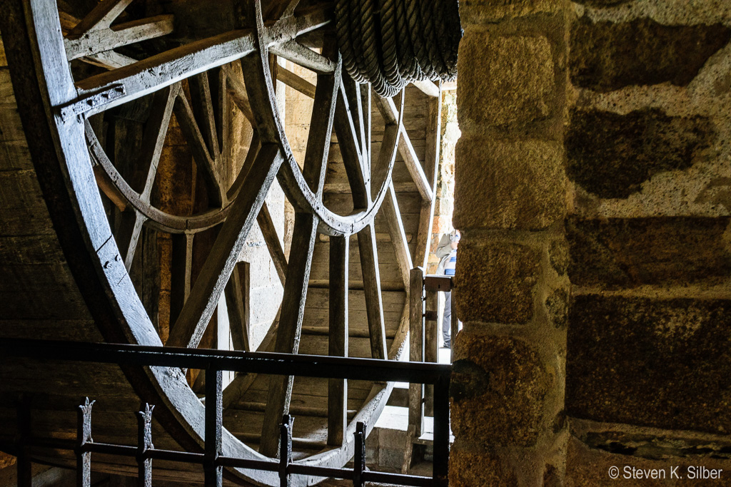 Men would walk in this wheel to drag supplies up the outside wall with the attached spool of rope. (1/8 sec at f / 8.0,  ISO 500,  24 mm, 18.0-55.0 mm f/3.5-5.6 ) May 12, 2017