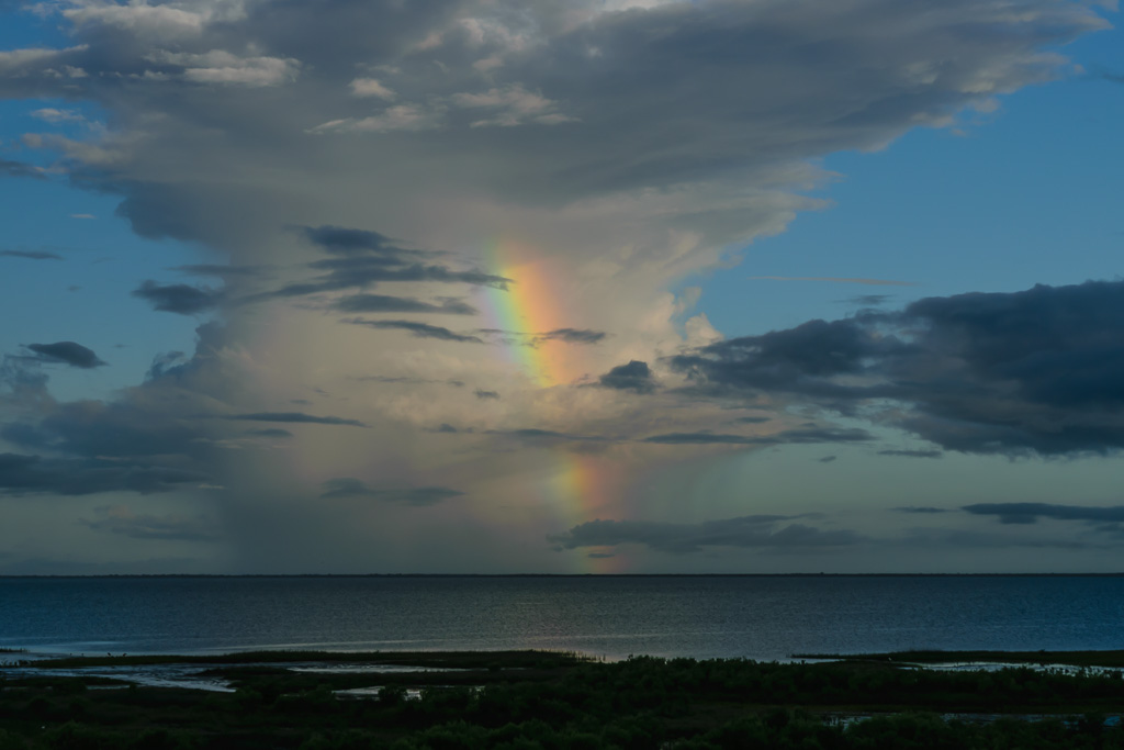 A morning rainbow against distant clouds. (1/100 sec at f / 14,  ISO 140,  55 mm, 18.0-55.0 mm f/3.5-5.6 ) June 28, 2017