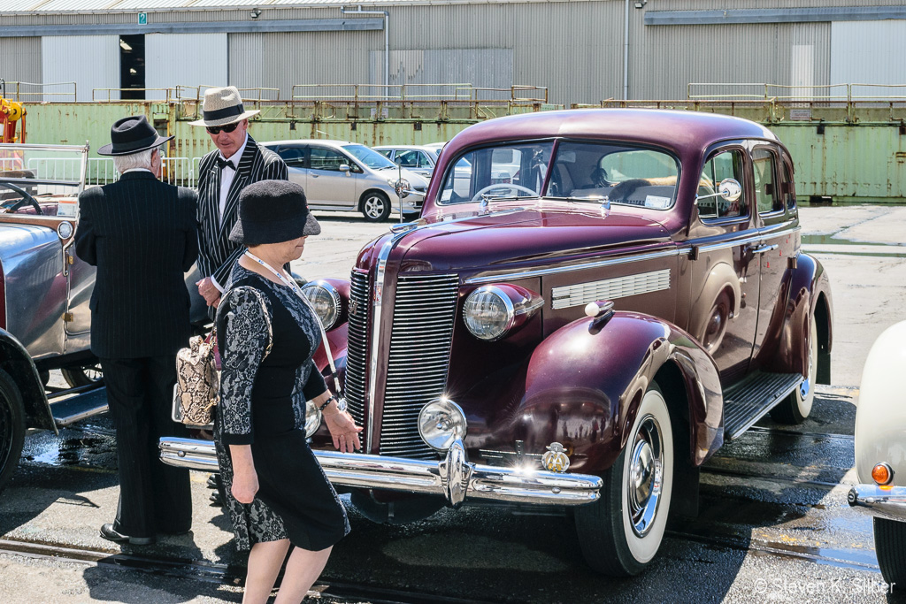 A number of antique cars, and owners in period dress, come out when ships are in port. (1/640 sec at f / 9.0,  ISO 200,  30 mm, 18.0-55.0 mm f/3.5-5.6 ) November 22, 2023