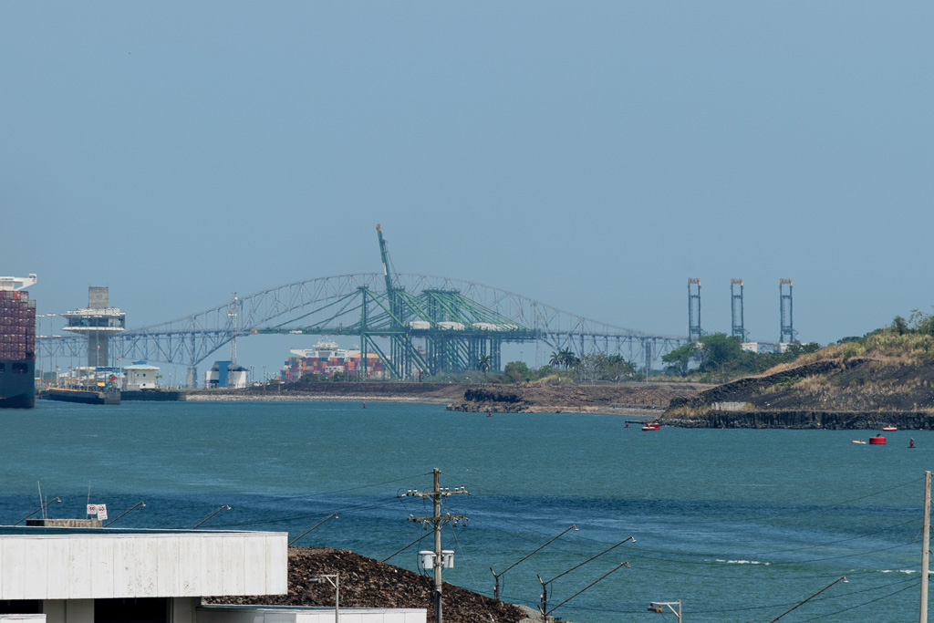 View of entrance to new, larger locks.   Old Bridge of the Americas in background. (1/1000 sec at f / 11,  ISO 400,  300 mm, 55.0-300.0 mm f/4.5-5.6 ) May 01, 2023